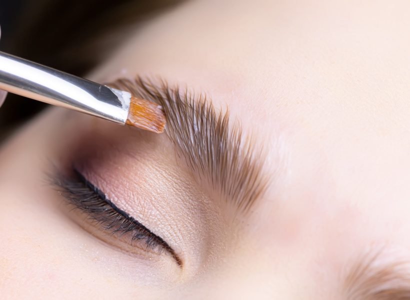 close-up of the procedure for long-term eyebrow styling, the master performs eyebrow lamination